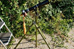 2026-08-12 Lumix DMC-GX7 camera with Hanimex 400mm lens and Tamron 2x Teleconverter mounted on Benbo Trekker tripod, with generic Arca-type quick release. Sun filter is a 90 mm x 110 mm welding glass, glued to a 72 mm - 82 mm step-up ring using black silicone bath sealer.