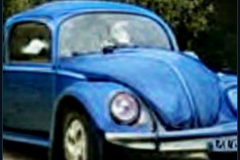 craiyon_000121_Jeremy_Clarkson_crashes_blue_Volkswagen_Beetle_br_