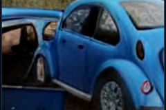 craiyon_000254_Jeremy_Clarkson_crashes_blue_Volkswagen_br_