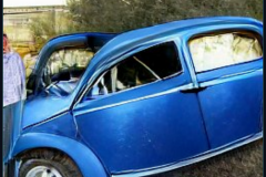 craiyon_000309_Jeremy_Clarkson_crashes_blue_Volkswagen_br_