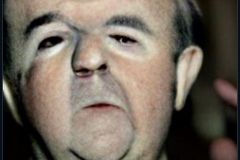 craiyon_000954_Ian_Hislop_hit_in_the_face_with_a_custard_pie_br_