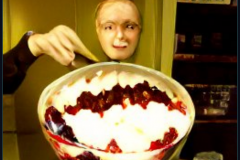 craiyon_001059_Ian_Hislop_stuffed_head_first_into_a_large_bowl_of_trifle_br_