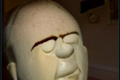 craiyon_001104_Ian_Hislop_stuffed_head_first_into_a_large_bowl_of_trifle_br_