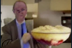craiyon_001304_Ian_Hislop_pushed_head_first_into_a_large_bowl_of_trifle_br_