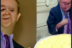 craiyon_002021_Ian_Hislop_pushed_face_first_into_a_large_bowl_of_trifle_br_