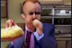 craiyon_002031_Ian_Hislop_pushed_face_first_into_a_large_bowl_of_trifle_br_