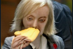 craiyon_114651_Liz_Truss_eating_large_cheese_br_