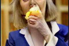 craiyon_114703_Liz_Truss_eating_large_cheese_br_