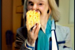 craiyon_114735_Liz_Truss_eating_large_cheese_br_