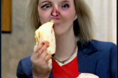 craiyon_114854_Liz_Truss_eating_large_cheese_br_