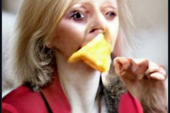 craiyon_114907_Liz_Truss_eating_large_cheese_br_