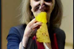 craiyon_115152_Liz_Truss_eating_large_cheese_br_