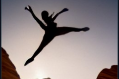craiyon_152721_A_photo_of_a_ballerina_in_silhouette_leaping_half_way_over_an_orange_canyon_at_sunset