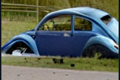 craiyon_235901_Jeremy_Clarkson_crashes_blue_Volkswagen_Beetle_br_