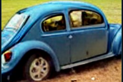 craiyon_235906_Jeremy_Clarkson_crashes_blue_Volkswagen_Beetle_br_
