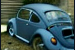 craiyon_235921_Jeremy_Clarkson_crashes_blue_Volkswagen_Beetle_br_