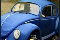 craiyon_235924_Jeremy_Clarkson_crashes_blue_Volkswagen_Beetle_br_