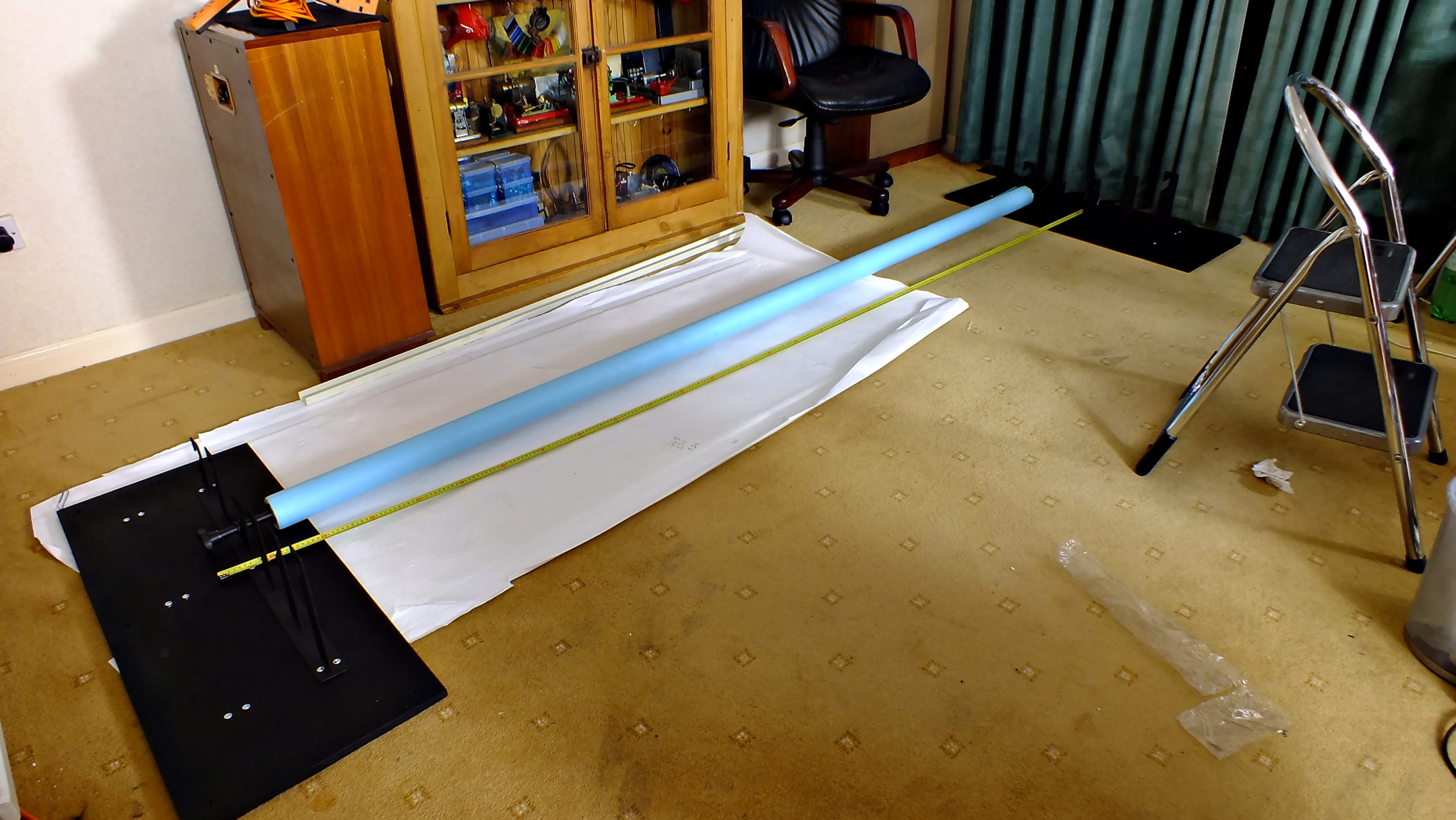 Measuring and calculating the exact distance required between plates in order to accommodate an actual 2.72 metre paper roll.