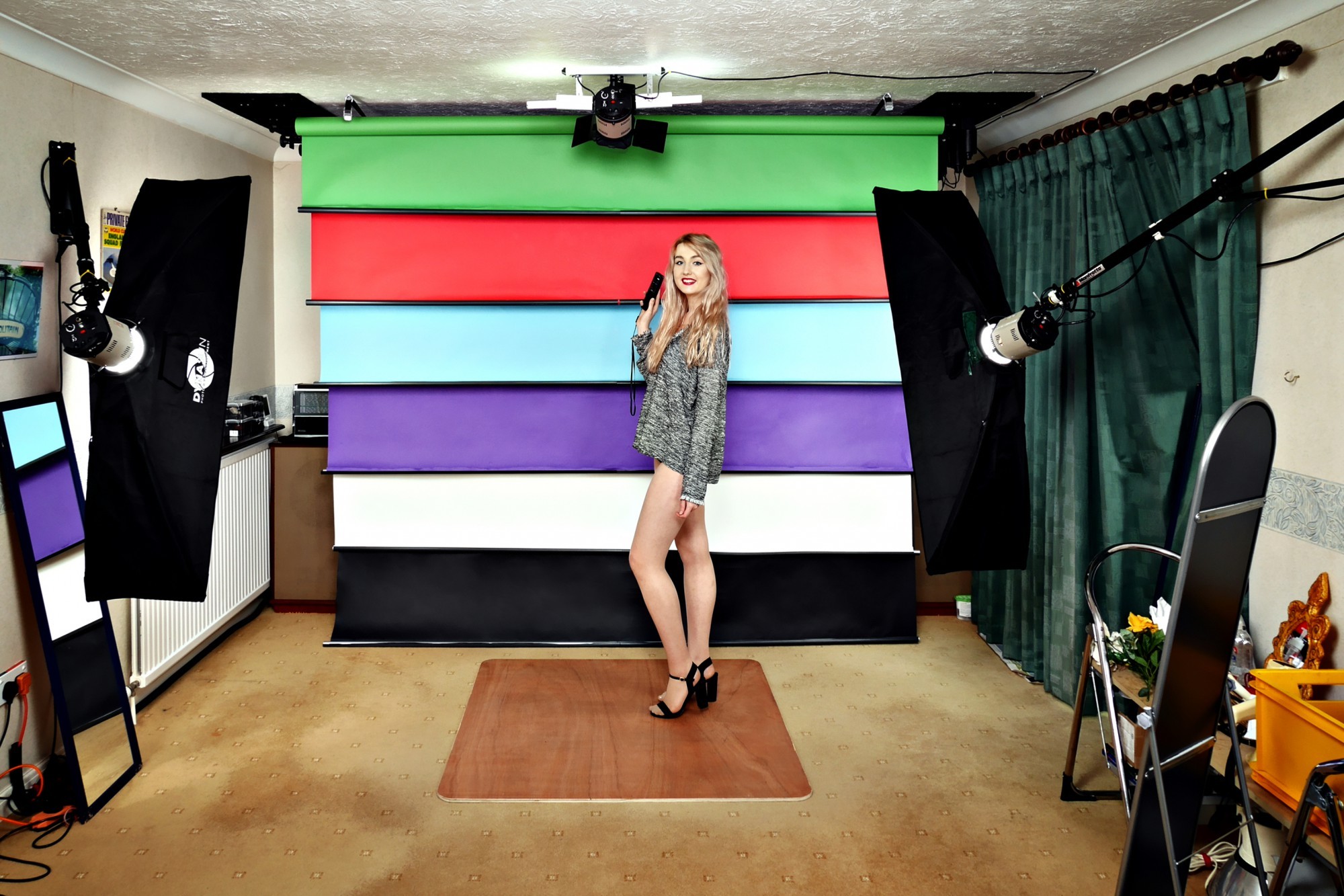 Model LilyAmber demonstrates the studio's 6-roll, radio-controlled, motorised backdrop system