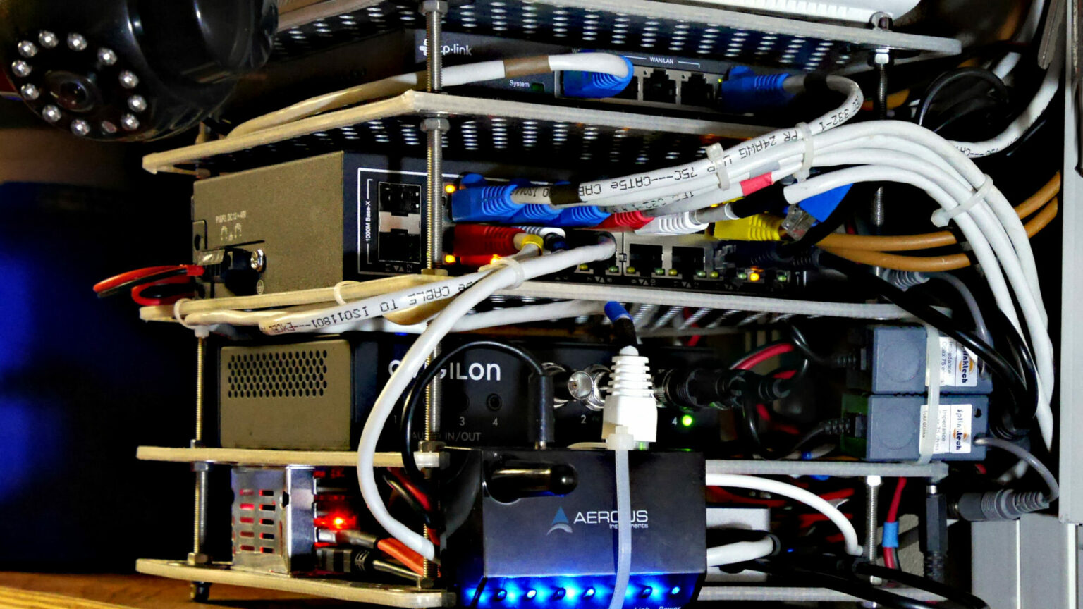 A fully loaded miniature stainless steel router rack